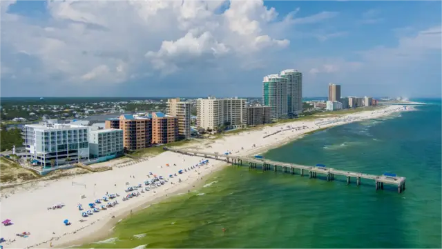 The Gulf State Park pier and the beachfront high-rises from the air