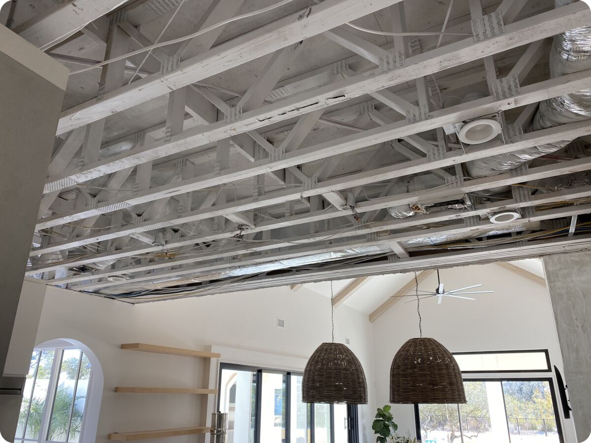 Ceiling opened up to the joists by DRI Gulf Coast during water damage restoration