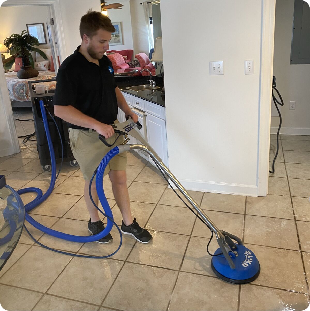 DRI Gulf Coast technician cleaning tile and grout